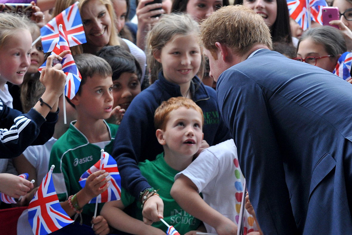 Prince Harry greets children as he arrives at the Maxxi Museum for the unveiling ceremony of the British pavilion at Milan's Expo 2015
