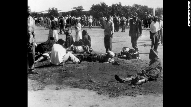 Wounded people in South Africa's Sharpeville township lie in the street on March 21, 1960, after police opened fire on black demonstrators marching against the country's segregation system known as apartheid. At least 180 black Africans, most of them women and children, were injured and 69 were killed in the Sharpeville massacre that signaled the start of armed resistance against apartheid.
