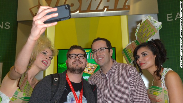 Jared "The Subway Guy" and Subway models pose for a selfie on March 8 with a fan.