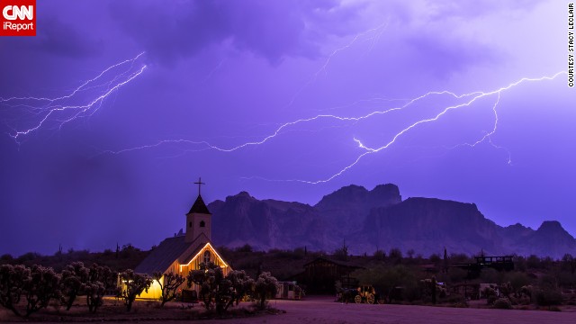Storm chaser <a href='http://ift.tt/1vcsxAM'>Stacy LeClair</a> got this shot during a severe storm that swept through Apache Junction, Arizona, on July 7. "The Superstition Mountains are a favorite landmark in Arizona, and the church offered a unique background for showing how powerful nature can be," she said. 