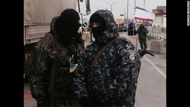 SOUTHERN UKRAINE: Gunmen block monitors from the Organization for Security and Co-operation in Europe (OSCE) who are trying unsuccessfully to negotiate their way into Crimea past pro-Russian border patrols on March 7. Photo by CNN's Christian Streib. Follow Christian on Instagram at http://ift.tt/1oUPDqV