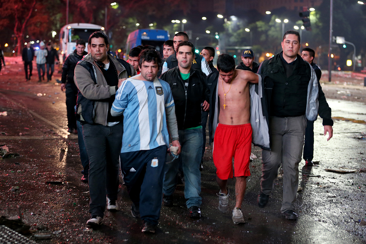 Football fans in Argentina shirts are arrested after violence broke out