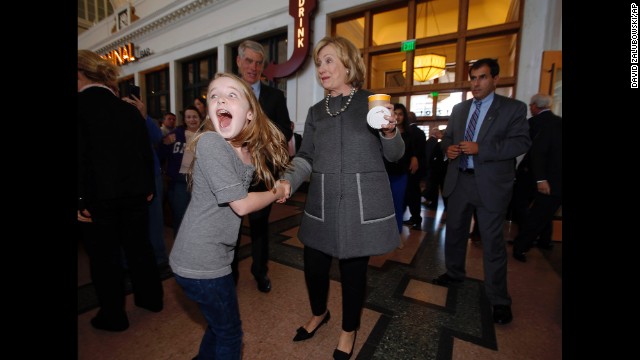 Clinton makes 10-year-old Macy Friday's day as she campaigns for U.S. Sen. Mark Udall during a stop Monday, October 13, in Union Station in Denver.