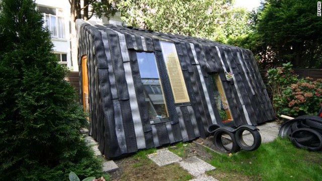 Dutch artist collective Rejunc turn wheels into walls for this garden office project. 