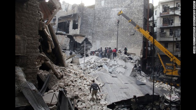 People dig through the rubble of a building in Damascus that was allegedly hit by government airstrikes on Thursday, February 27. 