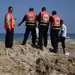 Rescuers at the remains of the Fun Time Beach cafe, hit by an airstrike. At least eight people were killed by a missile, apparently targeting what Israel’s military said was a single terrorist.