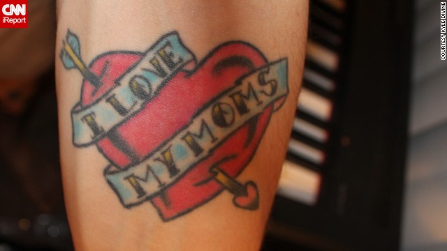 Kyle Divine honors both his moms with a tattoo he got on his arm on Mother's Day in 2006. "My moms were the best role models I had while I was growing up, regardless of sexual orientation," he said. "I got the tattoo to show them and the world that I am proud to have them as my parents." It also has a more subtle meaning: "Without actually saying it, the tattoo says that I am a supporter of gay rights." Divine says both his moms love the ink.