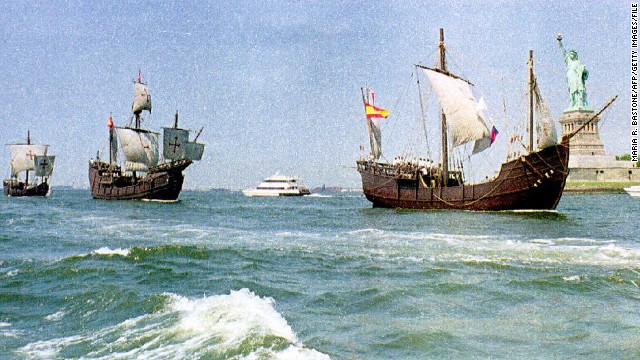 Replicas of Christopher Columbus' ships, the Nina, Pinta and Santa Maria, sail past the Statue of Liberty.