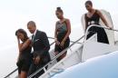 Obama and his family arrive aboard Air Force One at Westchester County Airport in White Plains