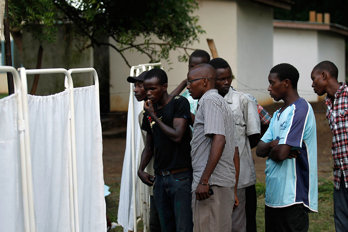 Residents gather to identify their relatives outside a mortuary containing bodies of people killed when gunmen attacked the coastal Kenyan town of Mpeketoni