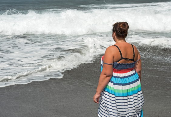 Dear Fat Person, You Don't Have to Lose Weight: Overweight woman looking at the ocean