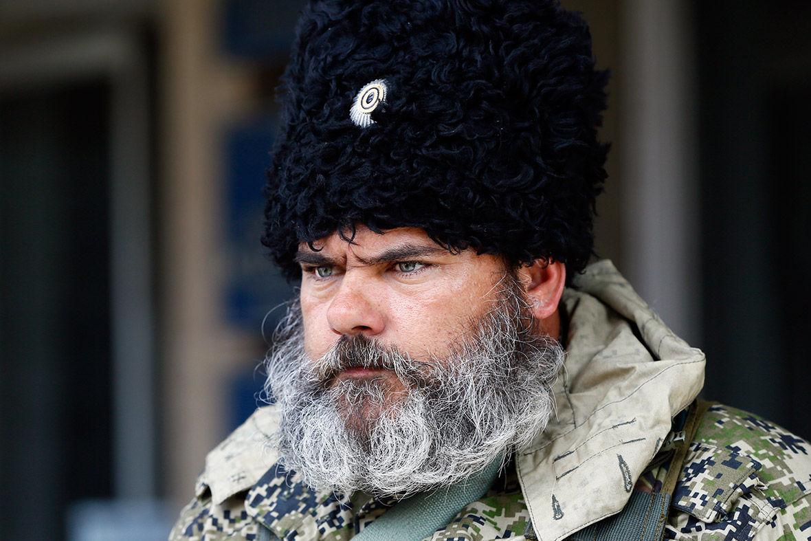 A pro-Russian separatist stands guard near the mayor's office in Slaviansk, eastern Ukraine