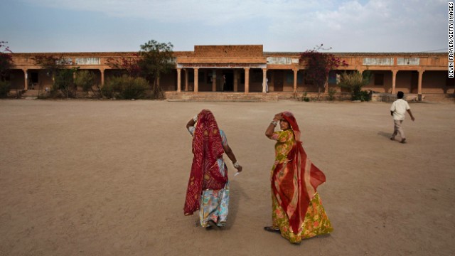 Women arrive to vote at a polling station on April 17, in the desert state of Rajasthan. 