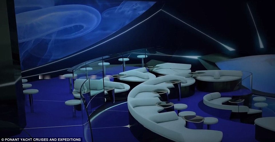 Holidaymakers can order a drink as they gaze at the underwater life visible out of the window in the submerged lounge area