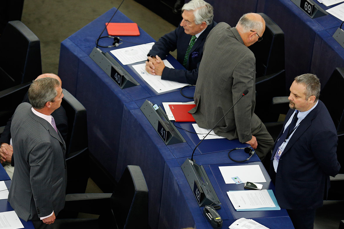 Ukip leader Nigel Farage and an other member of his group turn their backs as the European anthem is played during the inaugural session at the European Parliament in Strasbourg