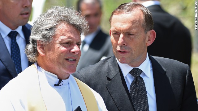 Australia Prime Minister Tony Abbott (right) arrives for the funeral of Australian cricket batsman Phil Hughes in Macksville, northern New South Wales on December 3.