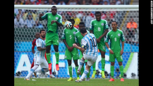 Argentina forward Lionel Messi scores his team's second goal against Nigeria. 