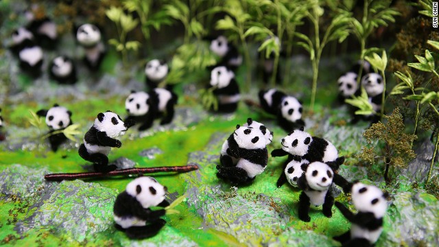 This panda scene was made by Nanjing velvet-flower artist Zhao Shu-xian. The Chinese word for velvet flowers refers to all figures made from thin copper sticks covered with silk velvet. Nanjing is the birthplace of many of the country's traditional arts. 