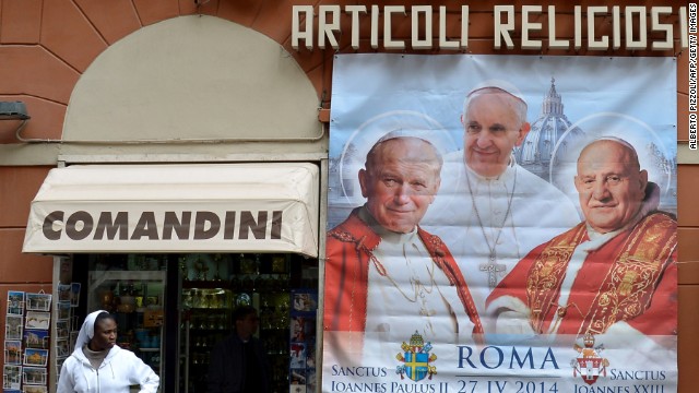 Pope John XXIII (right) is to be canonized alongside Pope John Paul II (left) by Pope Francis (center) on April 27, 2014.