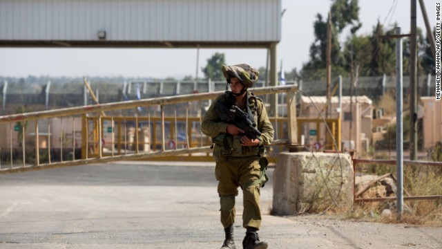 An Israeli soldier walks near a border crossing Sunday in Quneitra. Israel shot down a drone over the area with a Patriot missile.