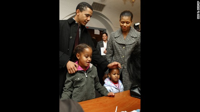 The Obamas check in with poll workers in Chicago in November 2004. Barack Obama would go on to win a U.S. Senate seat.