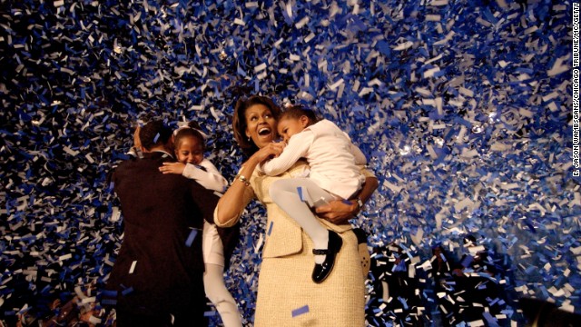 The Obamas celebrate during a victory party in Chicago on November 2, 2004.