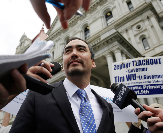 Tim Wu, a candidate for New York lieutenant governor, talks to reporters outside the state Capitol on Thursday, Aug. 28, 2014, in Albany, N.Y.