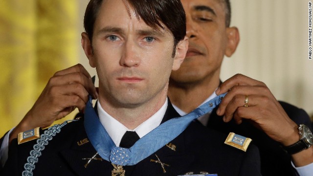 President Barack Obama gives former U.S. Army Capt. William Swenson the Medal of Honor during a White House ceremony on October 15, 2013. Swenson was cited for "his exceptional leadership and stout resistance against the enemy during six hours of continuous fighting" in the September, 8, 2009, Battle of Ganjgal in the Kunar province of Afghanistan, according to the Army. 
