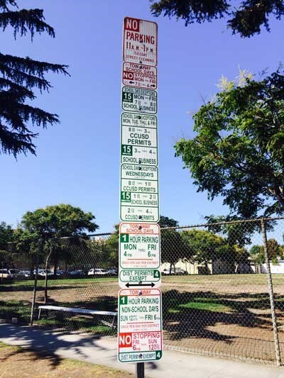 The Parking Sign at a California School is Determined to Reach the Heavens
