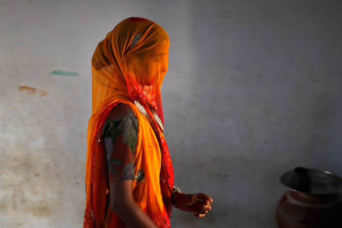 A woman leaves a polling station in Ajmer district after casting her vote