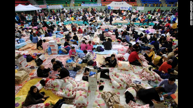 Family members of passengers who were aboard the sunken ferry gather at a gymnasium in Jindo on April 17.