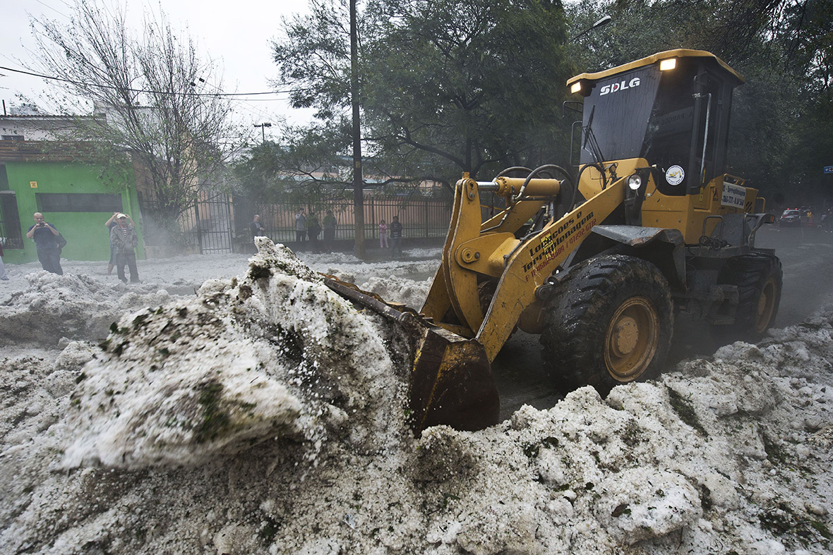 A bulldozer clears hailstones from a street after a huge storm in Sao Paulo, Brazil. A layer of hailstones as deep as 20 centimetres covered streets and parks