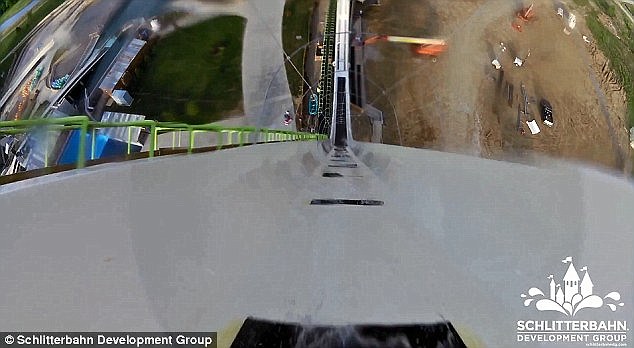 This is the moment two daredevils try out the vertigo-inducing world's tallest water slide, which starts off with a breath-taking 168ft drop 