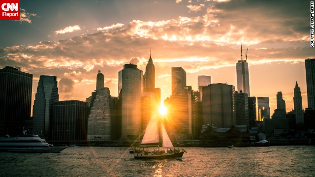The sun drifts below the New York City skyline on a late June evening. <a href='http://ift.tt/1qBnBpR'>Jeremy Aerts</a> found the perfect spot to drink in the view of the East River at Brooklyn Bridge Park.