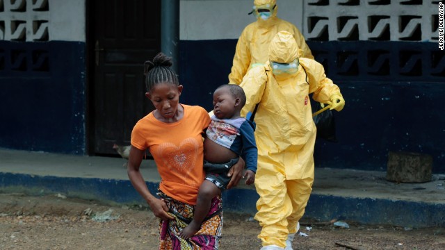 Marie Nyan, whose mother died of Ebola, carries her 2-year-old son, Nathaniel Edward, to an ambulance after showing signs of the virus in the Liberian village of Freeman Reserve on Tuesday, September 30. Health officials say the Ebola outbreak in West Africa is the deadliest ever. More than 3,000 people have died, according to the World Health Organization.