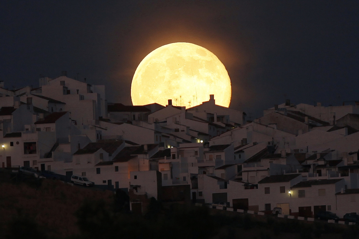 The Supermoon rises over houses in Olvera, in the southern Spanish province of Cadiz