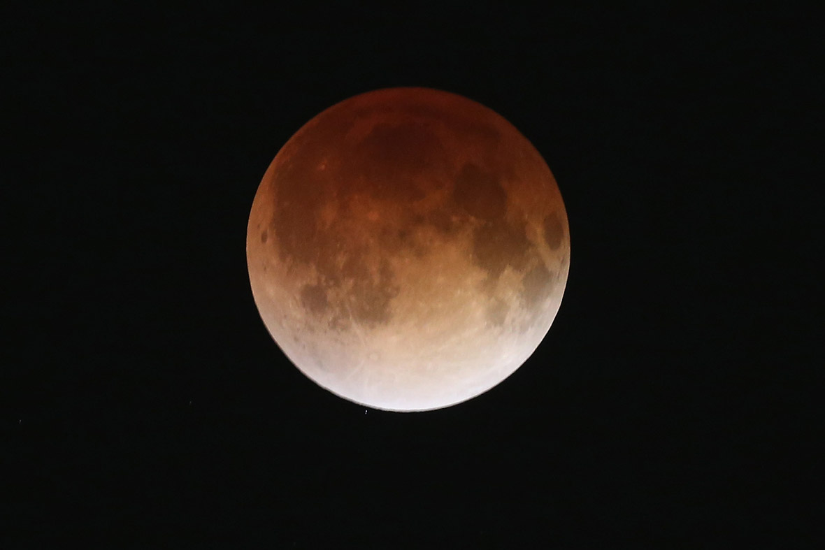 The moon turns red causing a phenomenon known as a 'blood moon', during a total lunar eclipse in Miami, Florida