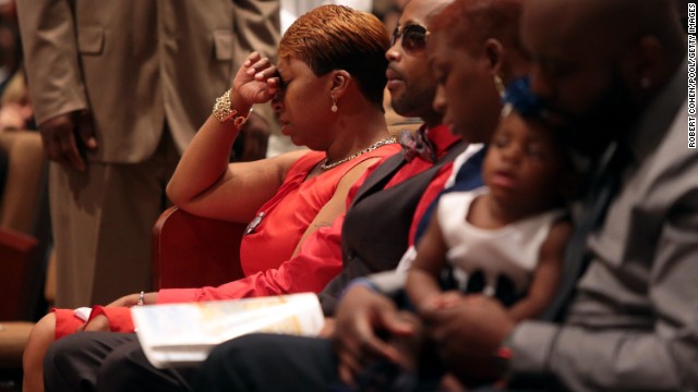 Lesley McSpadden, Brown's mother, sits during the funeral on August 25.