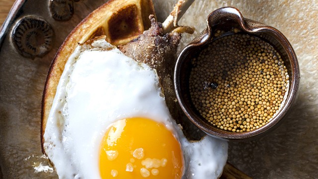 What to order at Duck and Waffle? Hint: the restaurant name is its signature dish -- crispy duck confit on a fluffy Belgian waffle with a fried duck egg and mustard-infused maple syrup.