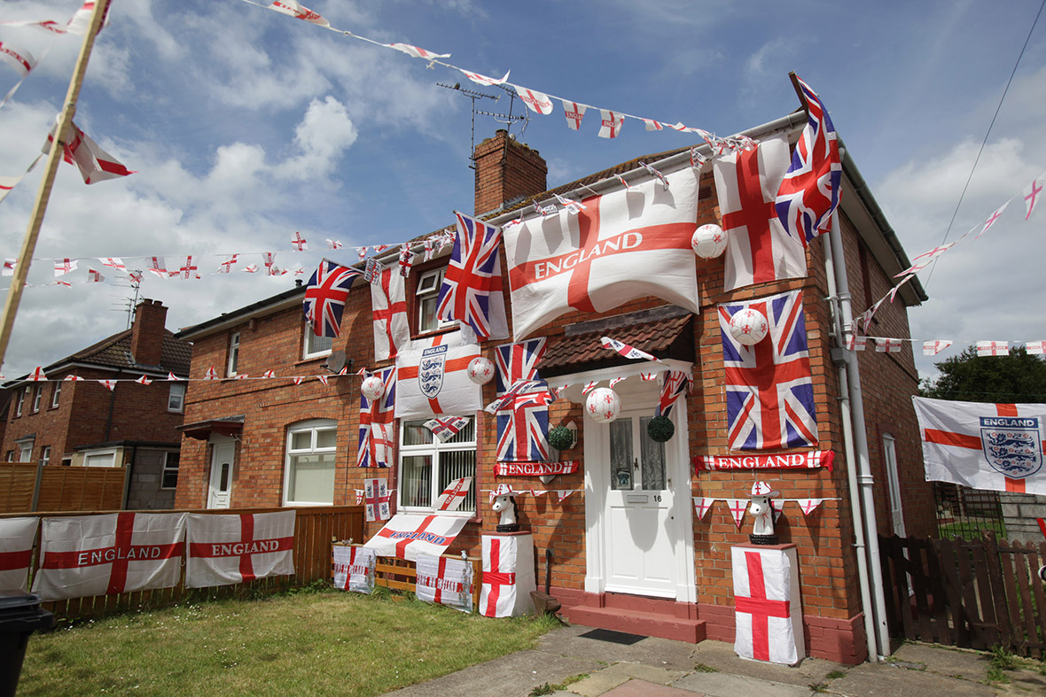 England and Union flags adorn a house in a street in the Knowle West area of Bristol, ahead of the football World Cup.
