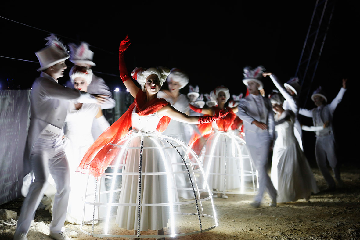 Performers act on stage during a dress rehearsal of Giuseppe Verdi's opera 'La Traviata' at the foothill of Masada, an ancient Jewish mountaintop fortress near the Dead Sea in southeast Israel.