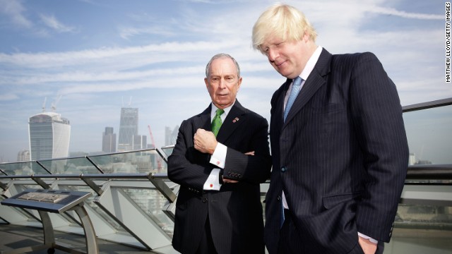 London Mayor Boris Johnson talks with Bloomberg on the balcony of London's City Hall after launching the Mayors Challenge in Europe. The Mayors Challenge is a competition, with prize money coming from Bloomberg's philanthropic foundation, that challenges cities to find innovative and creative ideas to solve problems faced by urban living. 