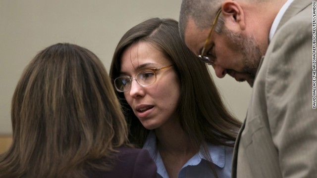 Arias talks to defense attorneys Willmott, left, and Kirk Nurmi during her trial on April 3. Her defense team says she was the victim of a controlling, psychologically abusive relationship.