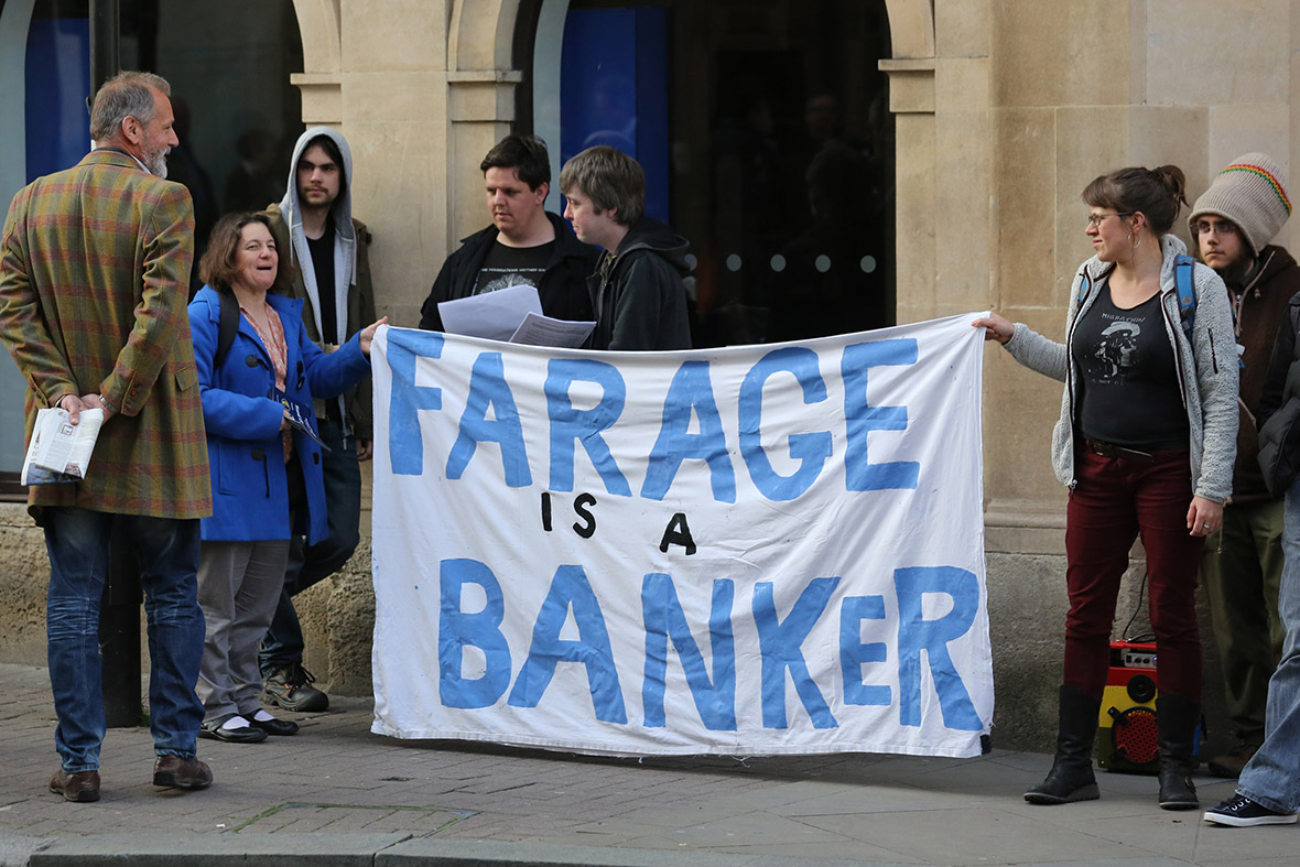 Demonstrators protest ahead of a meeting held by UK Independence Party leader Nigel Farage at The Forum in Bath