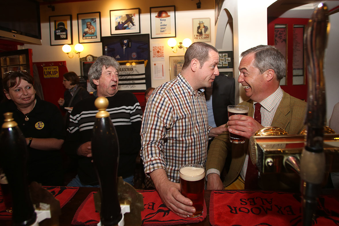 UK Independence Party leader Nigel Farage enjoys a pint with Paul Alvis, the landlord of Volunteer Rifleman's Arms, as he visits Bath to meet with party members, candidates and supporters