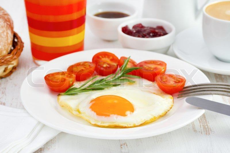 orange juice and eggs and tomatoes