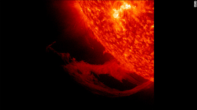 This close-up view of a prominence reveals magnetic forces at work as they pull plasma strands this way and that before it gradually breaks away from the sun over a one-day period November 14-15, 2011.