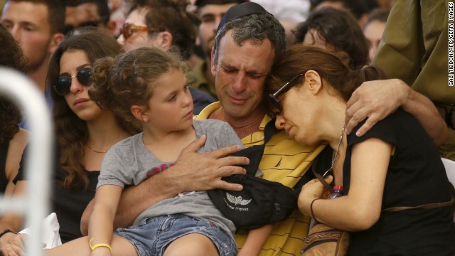 The parents and a sister of Israeli soldier Guy Algranati mourn during his funeral in Tel Aviv on July 31.