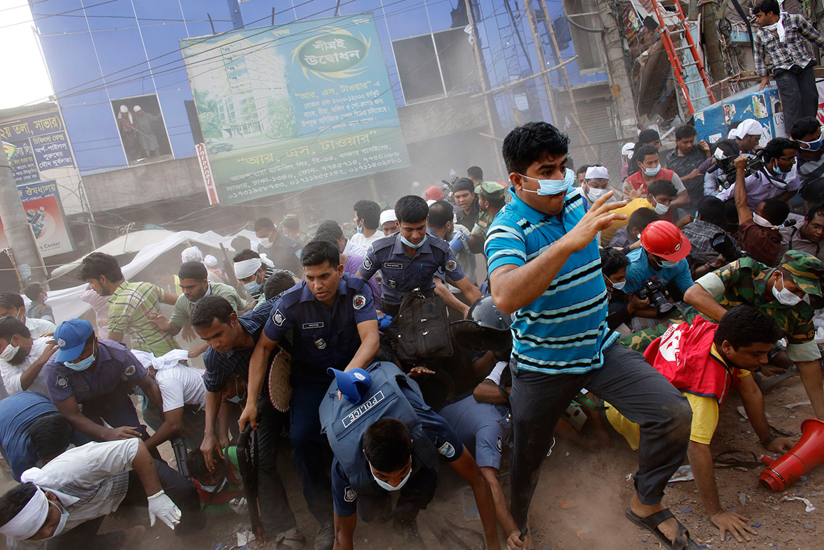 April 26, 2013: Rescue workers, army personnel, police and members of media run after someone shouted that a building next to Rana Plaza was collapsing