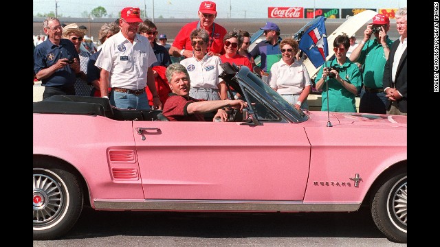 Clinton rides in a 1967 Ford Mustang during a visit to the Charlotte, North Carolina, Motor Speedway on April 17, 1994.